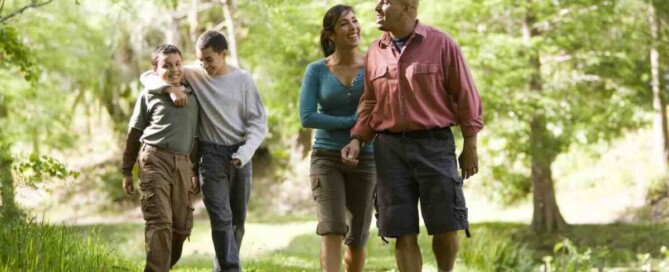 picture of couples walking a wooded path
